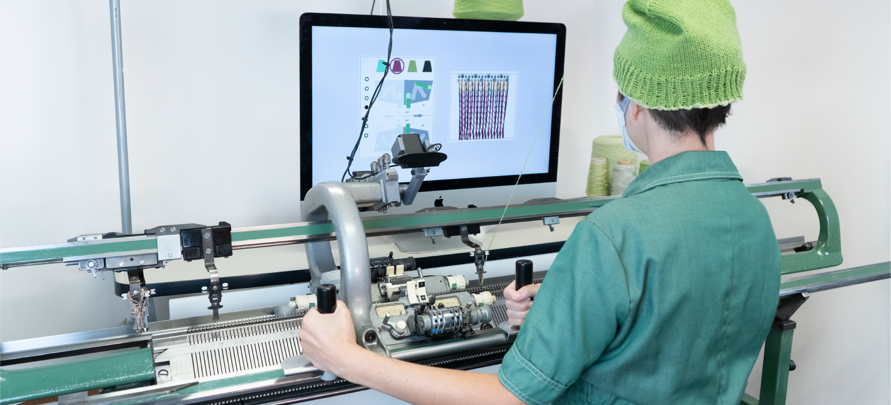 Our system augments an otherwise purely mechanical knitting machine.